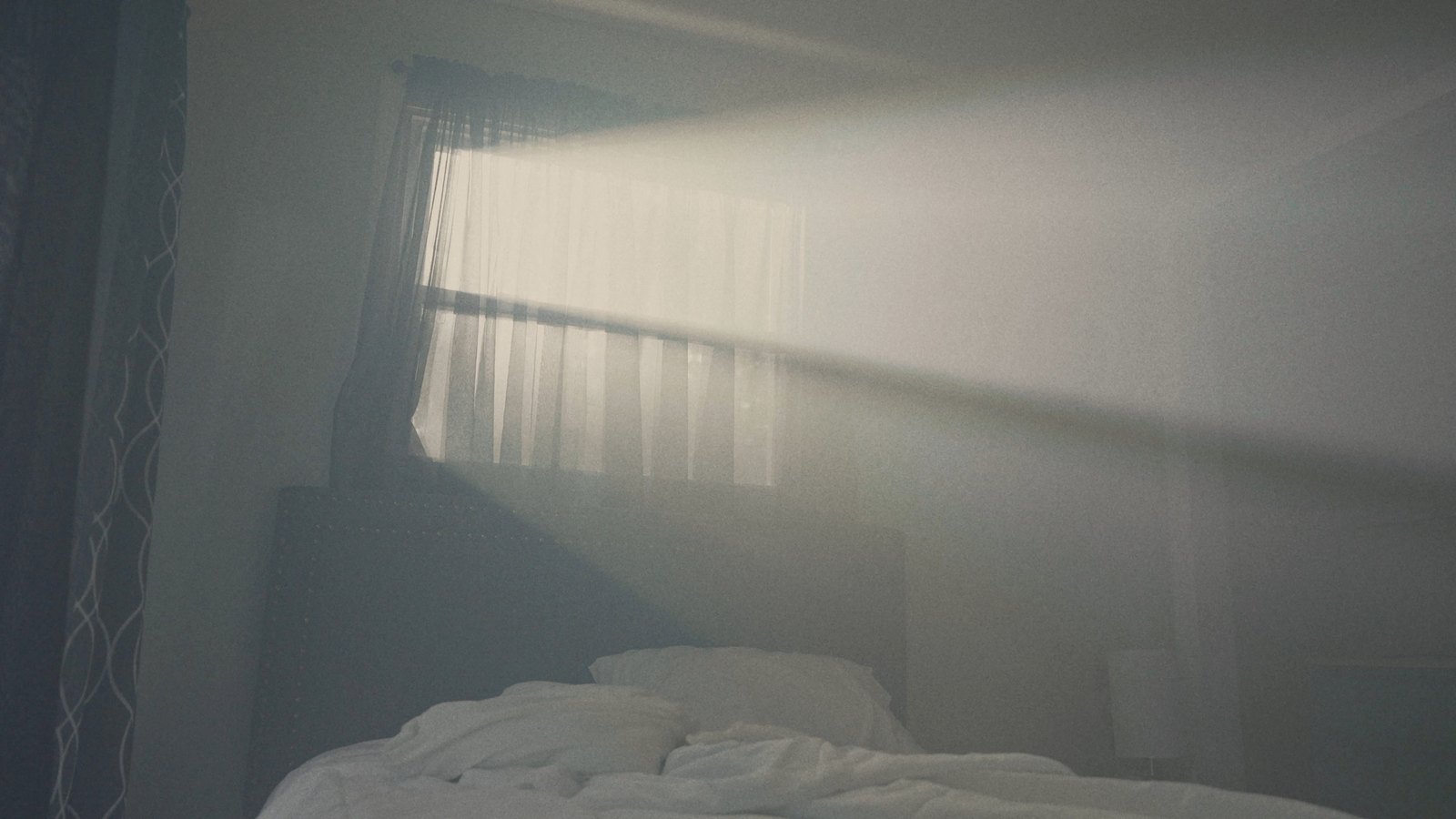 Morning light across the bed